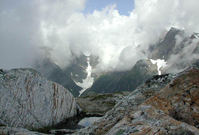 Ridge Top Pool and Cloud Covered Peaks (47451 bytes)